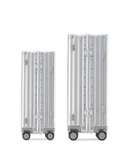 POSHPOSH aluminium suitcases shown side by side in anodised aluminium with matching PP monogram hinge plates