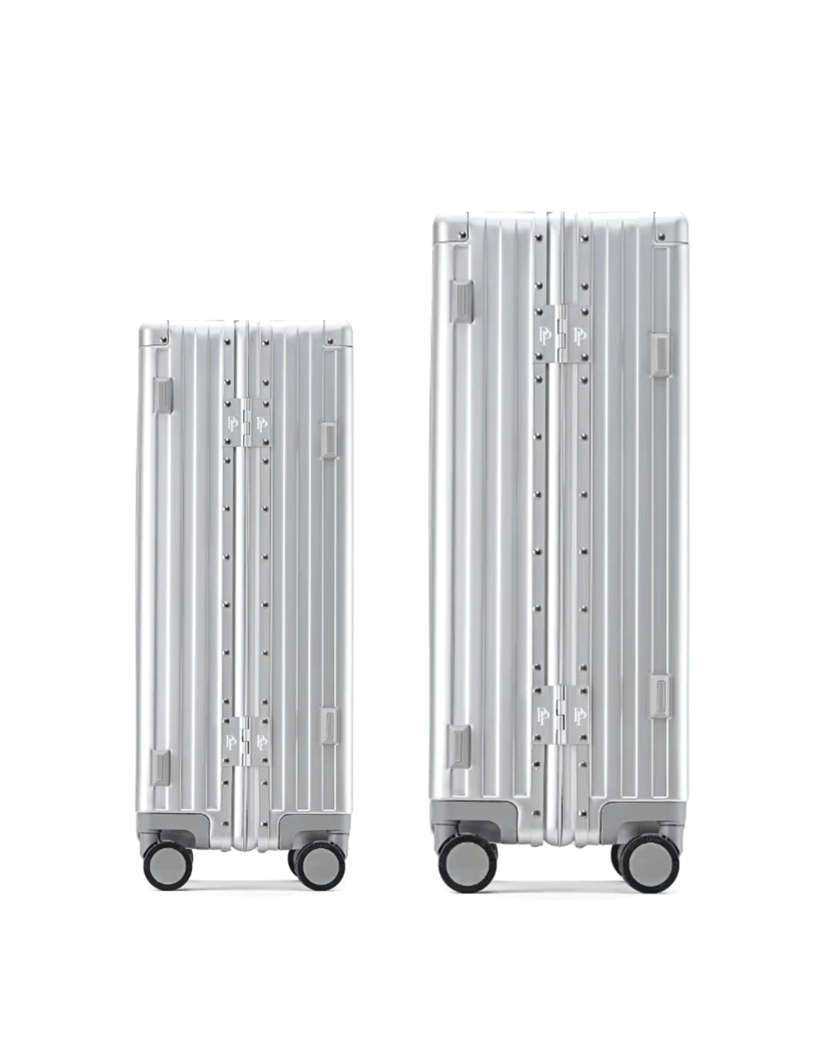 POSHPOSH aluminium suitcases shown side by side in anodised aluminium with matching PP monogram hinge plates