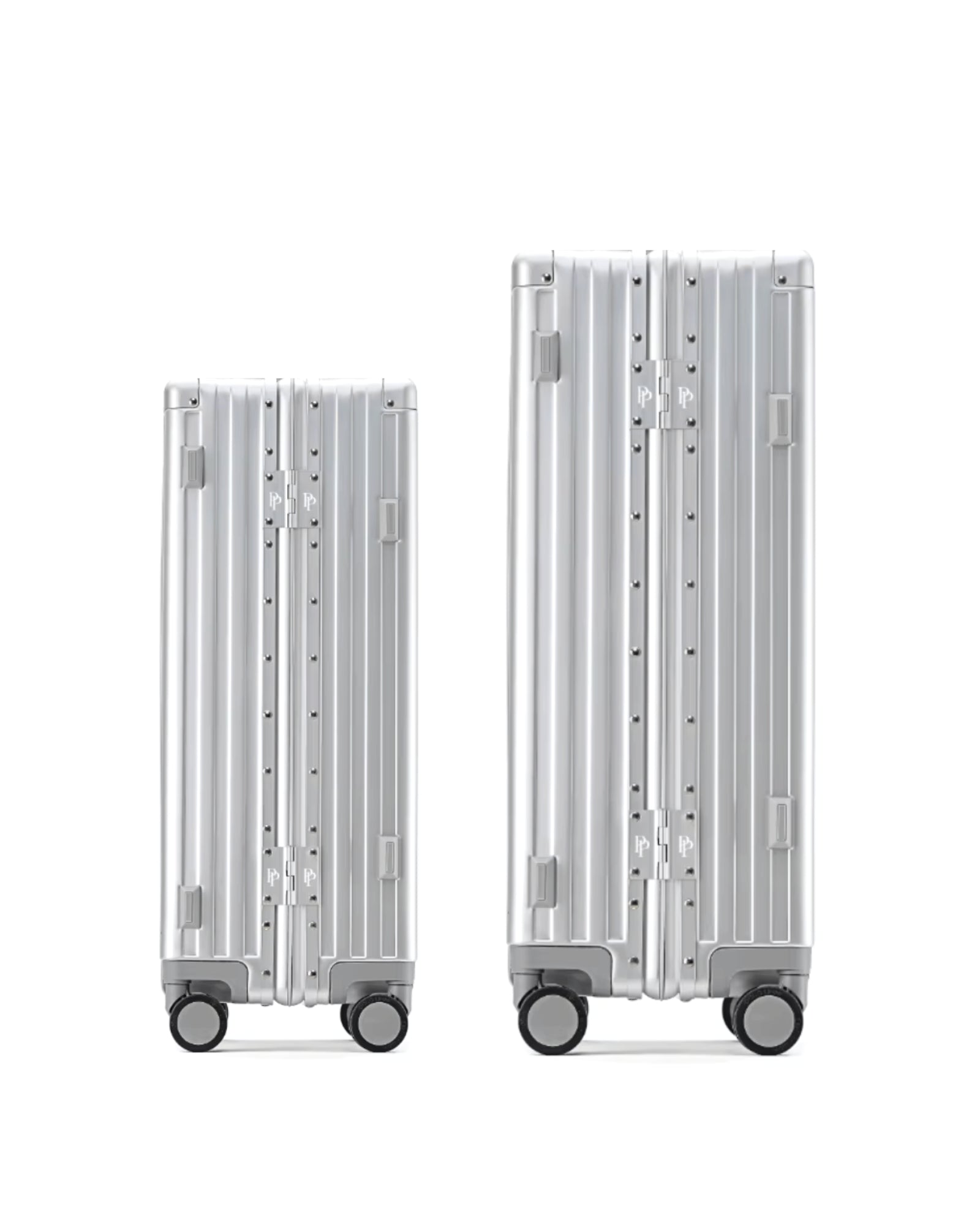 POSHPOSH Aluminium Cabin and Check-In suitcases shown side by side, both in anodised aluminium with matching PP monogram hinge plates
