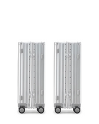 The POSHPOSH Aluminium Cabin Set seen from behind, showing the vertical shell seam and PP monogram hinge plates on both cases