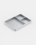 POSHPOSH Aluminium Tray in satin anodised aluminium, seen at an angle, with one large and two small compartments